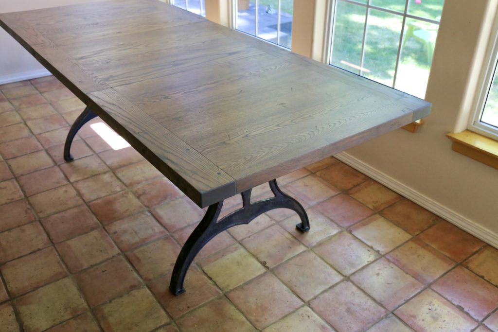 Custom white oak dining table with cast iron legs